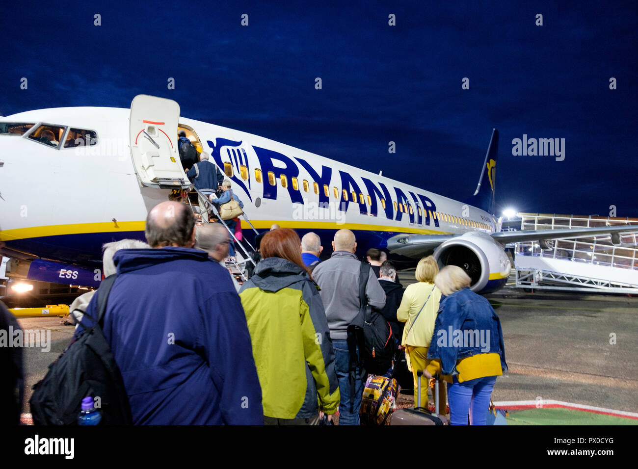 Passengers board a Ryanair aircraft for a flight from Glasgow Prestwick