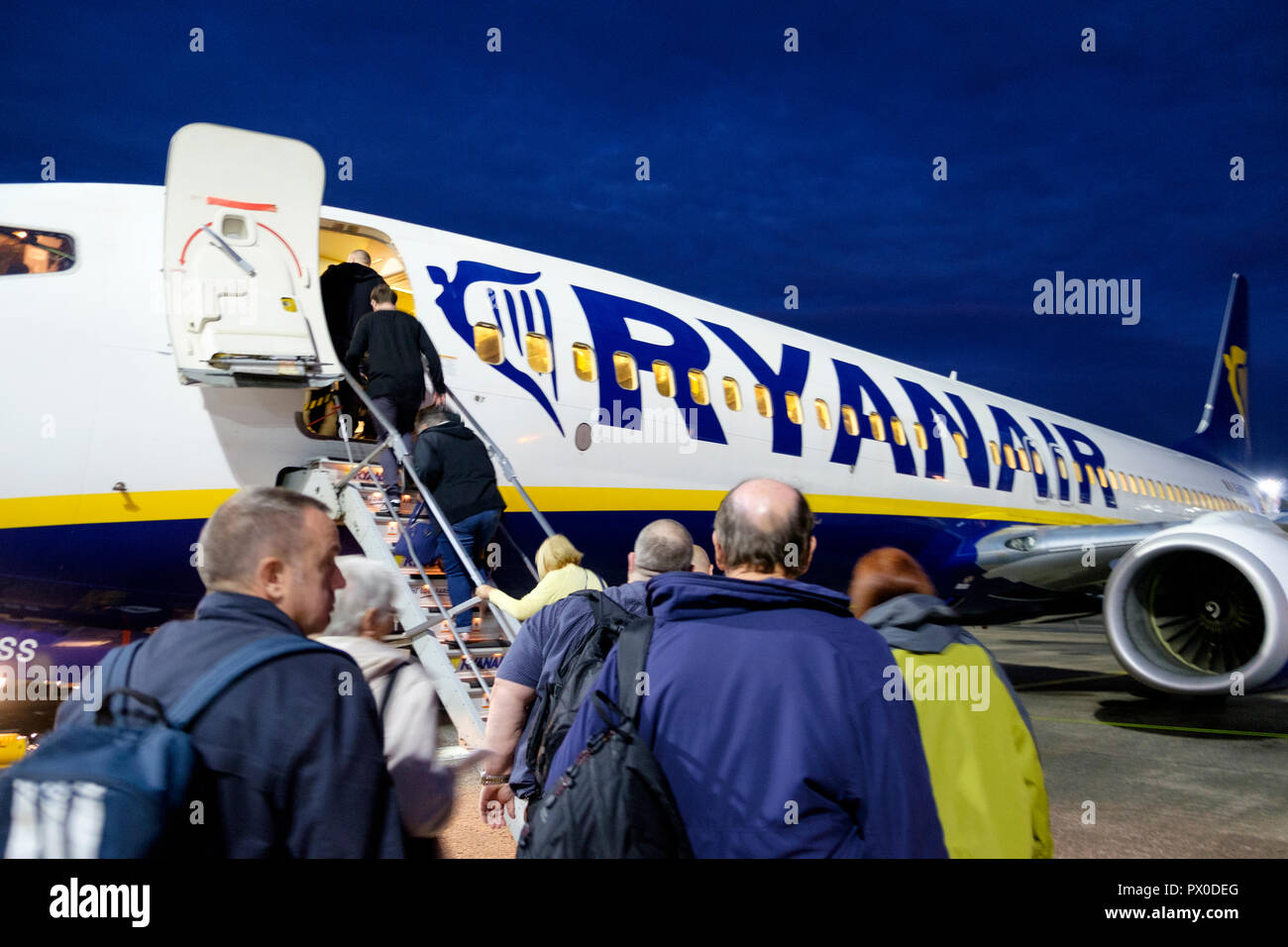 Passengers board a Ryanair aircraft for a flight from Glasgow Prestwick airport. Stock Photo