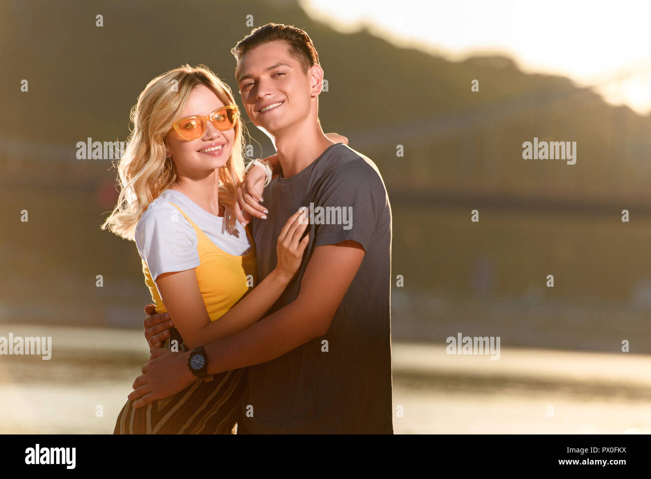 Young couple hugging on the beach hi-res stock photography and images ...