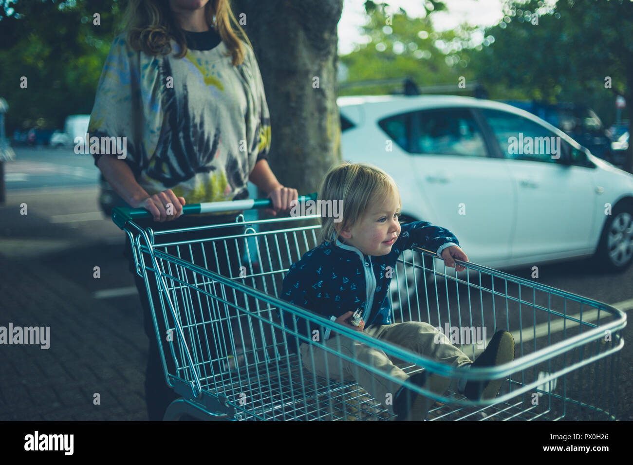 Riding shopping cart hi-res stock photography and images - Alamy