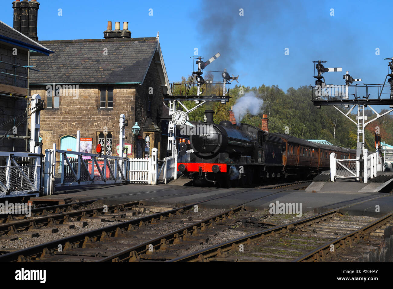 Passenger train leaving Grosmont Station, North Yorkshire Moors, on the NYMR line from Whitby to Pickering, U.K. Stock Photo