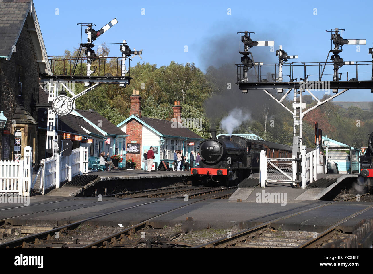 Steam train with carriages about to depart from Grosmont Station on the NYMR heritage railway line between Whitby and Pickering, North Yorkshire. Stock Photo