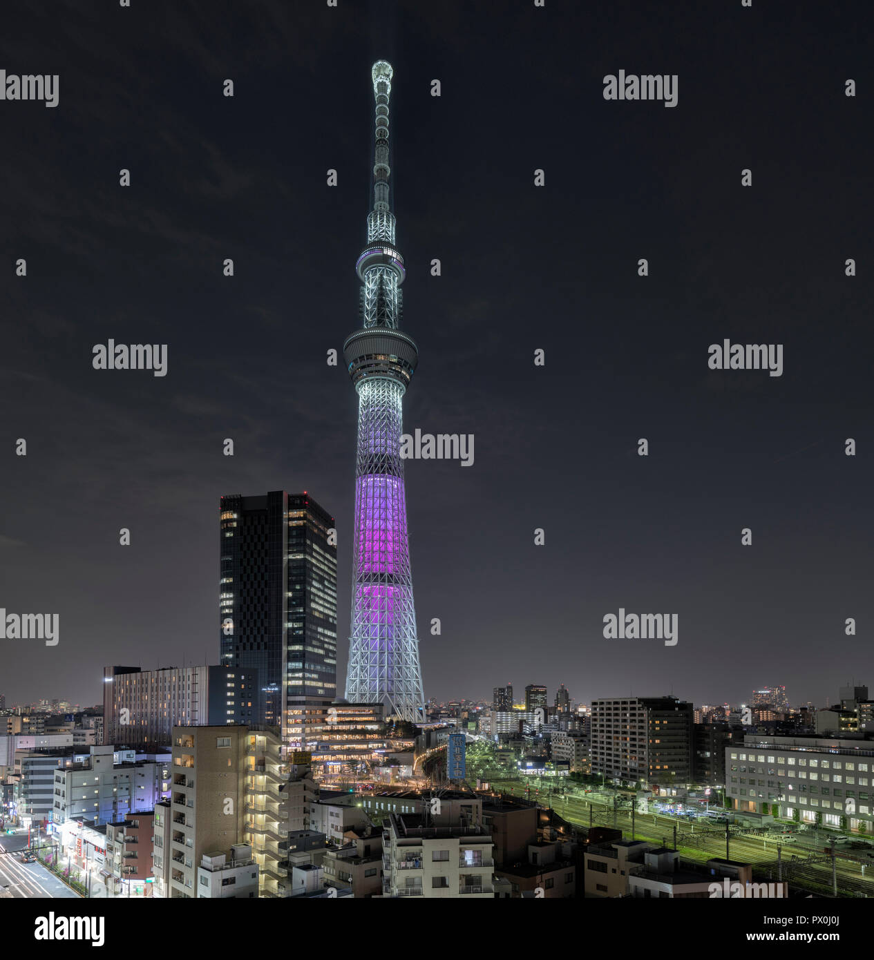 Tokyo Skytree tower in Sumida, Japan with surrounding urban residental context below. The tower was completed in 2012. Stock Photo