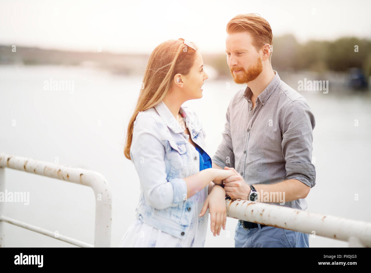 Cute couple enjoying time spent together outdoors Stock Photo
