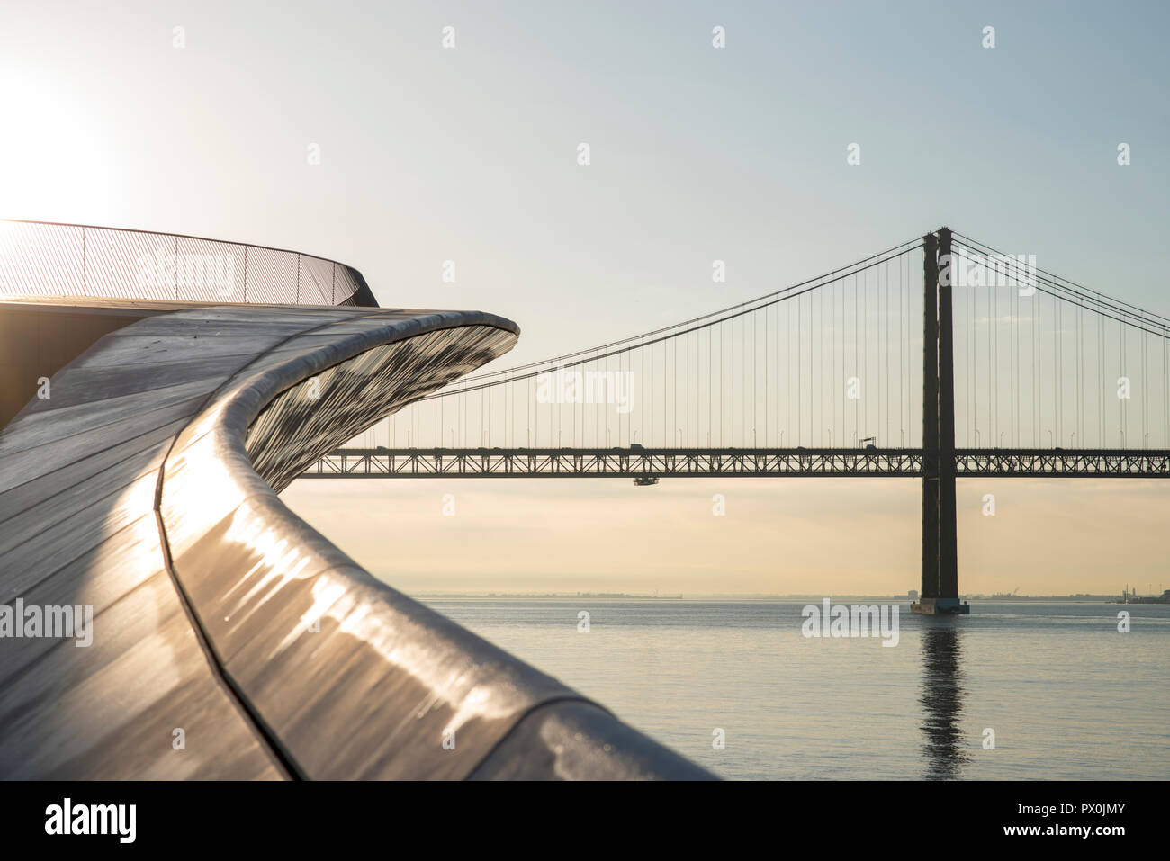 Exterior view of The MAAT - Museum of Art, Architecture and Technology, Lisbon, Portugal. View of bridge over river Targus. Stock Photo