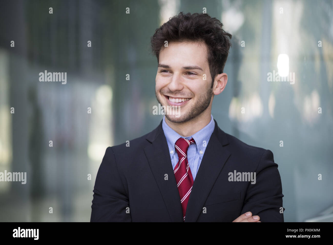 Portrait of a young smiling businessman Stock Photo - Alamy