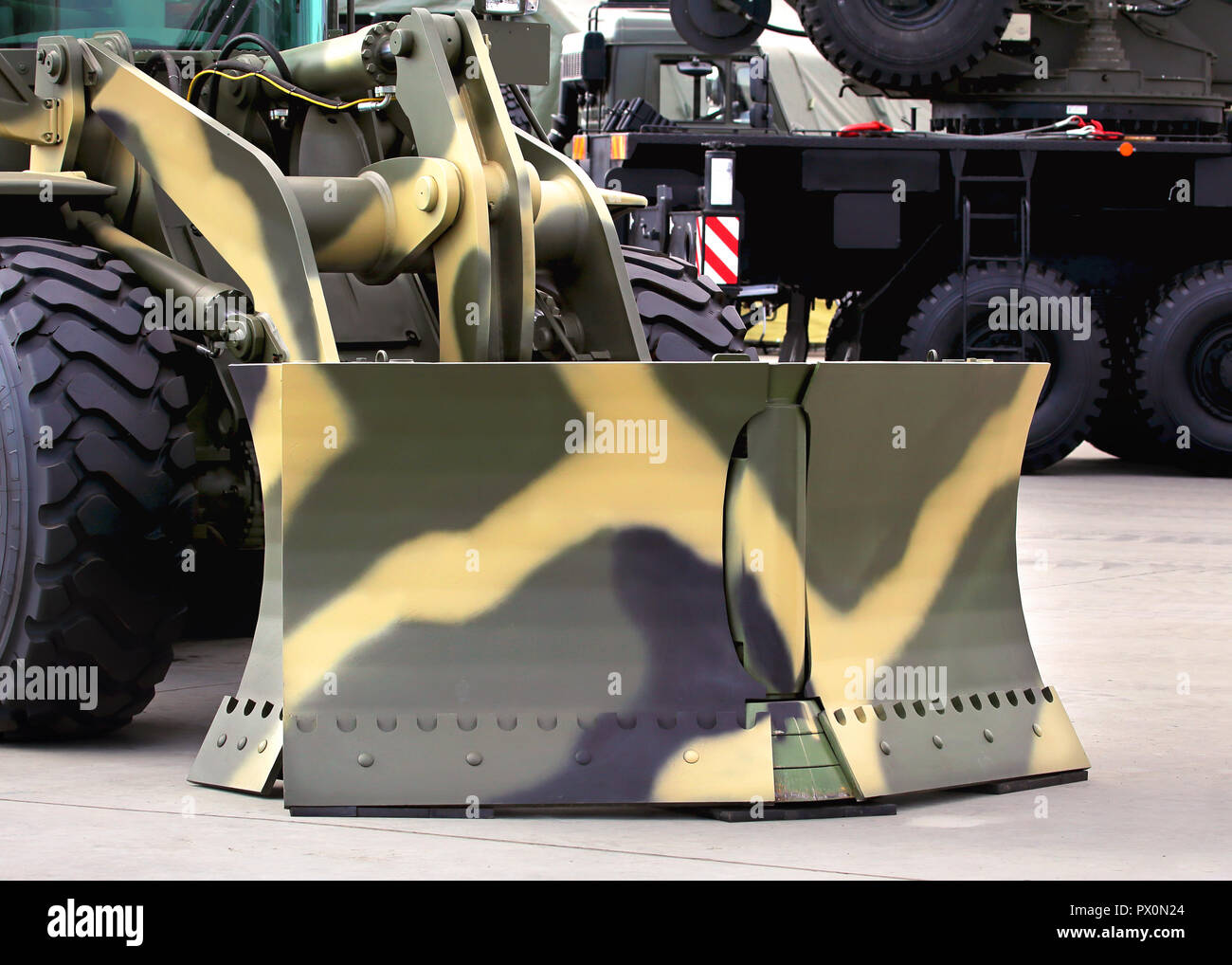 Army obstacle clearing machines bucket Stock Photo - Alamy