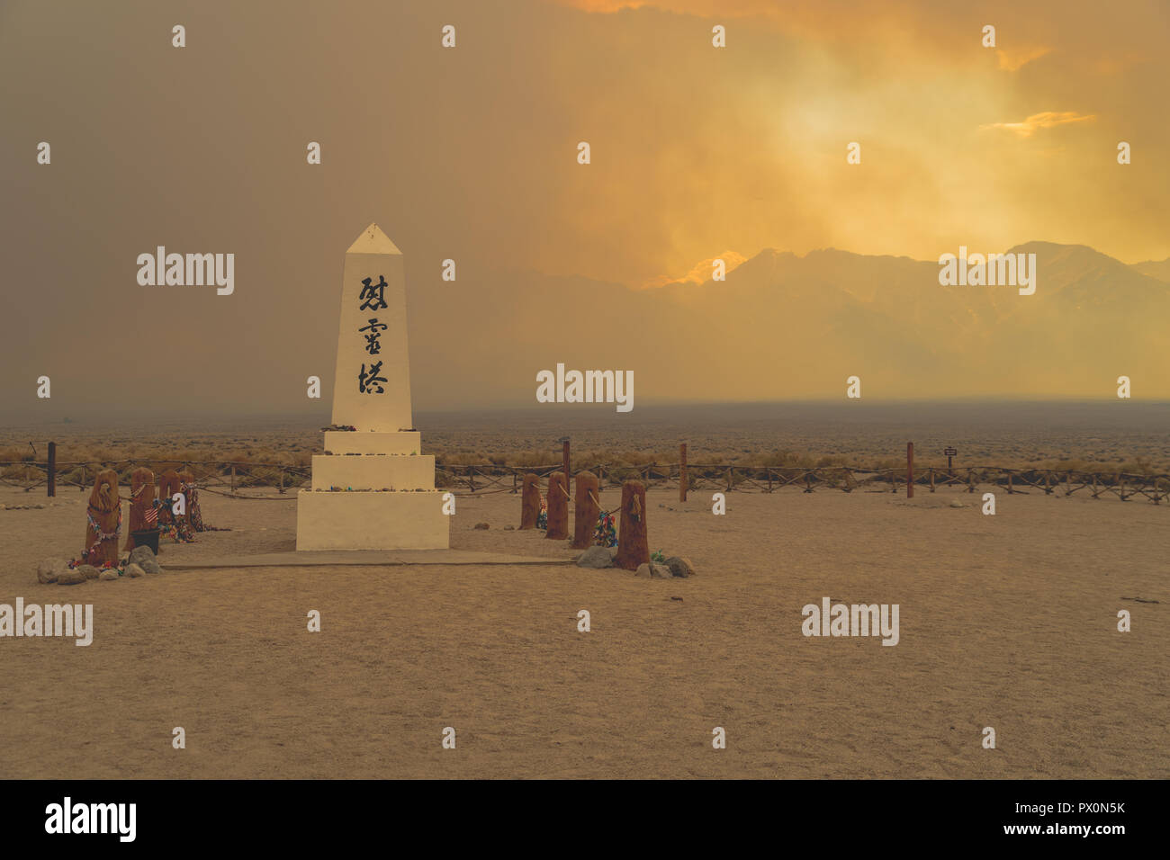 Manzanar National Historic Site Monument in Inyo County California. Nearby wildflire gives an orange smokey hue to the photo Stock Photo