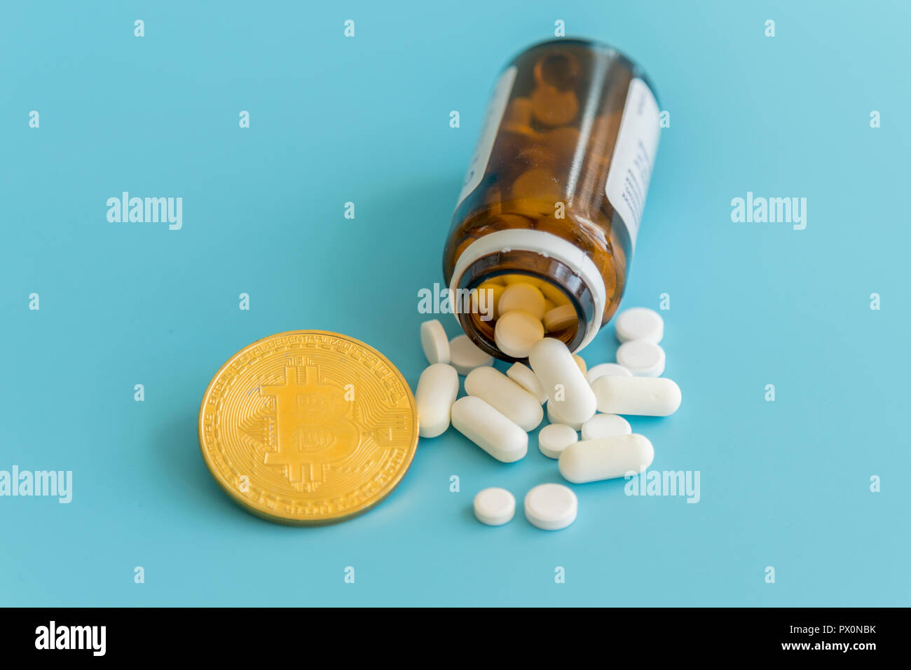 Bitcoin and pills on a blue background. Bitcoin as a medicine for the  economy. Cryptocurrency bitcoin as a payment option for medicines. The  concept o Stock Photo - Alamy