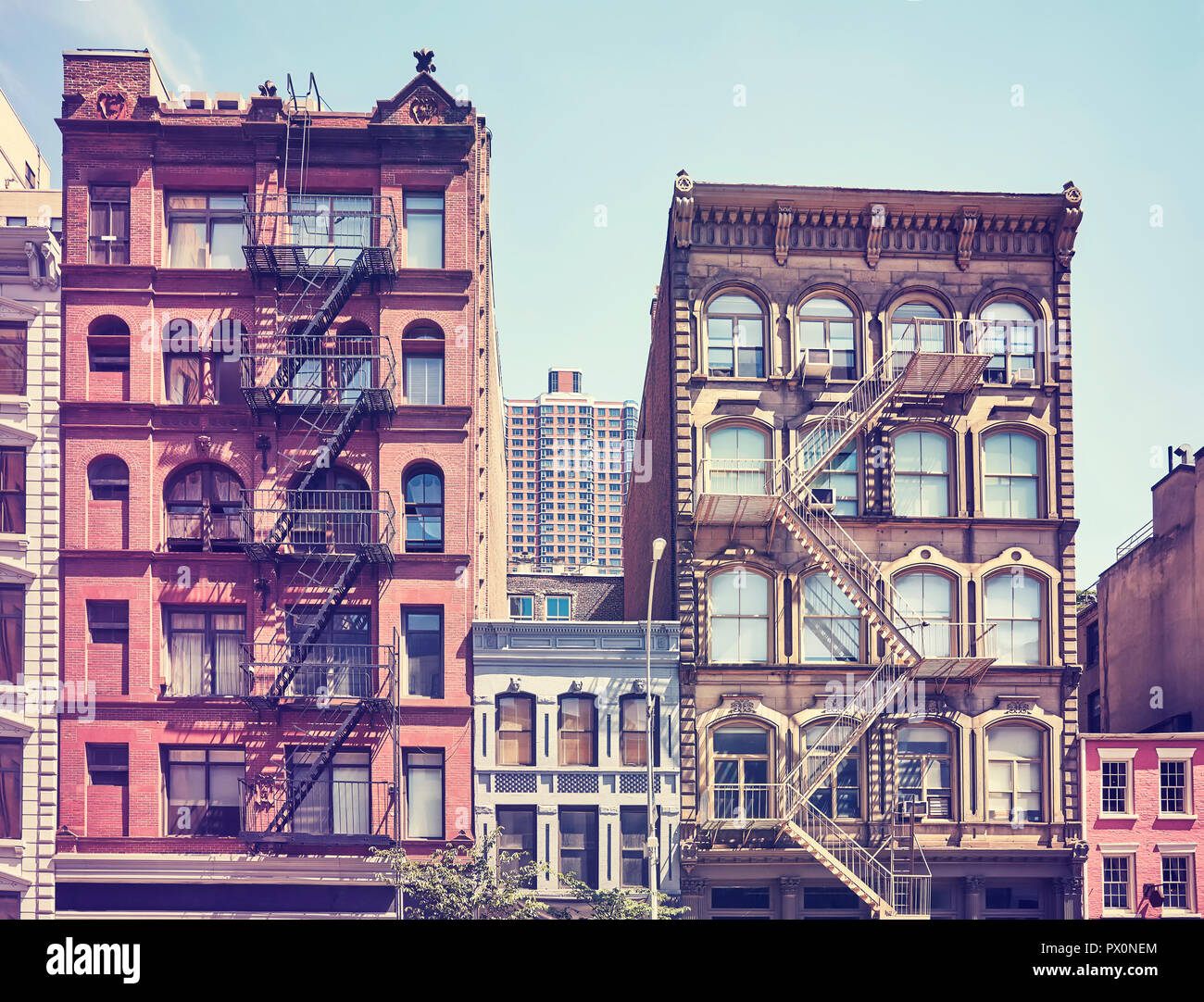 Old buildings with fire escapes, one of the New York City symbols ...