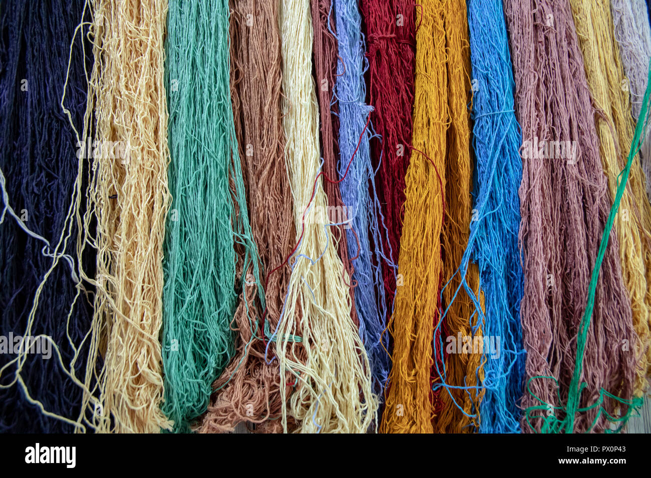 Shanks of colorful silk carpet yarn hanging Stock Photo Alamy