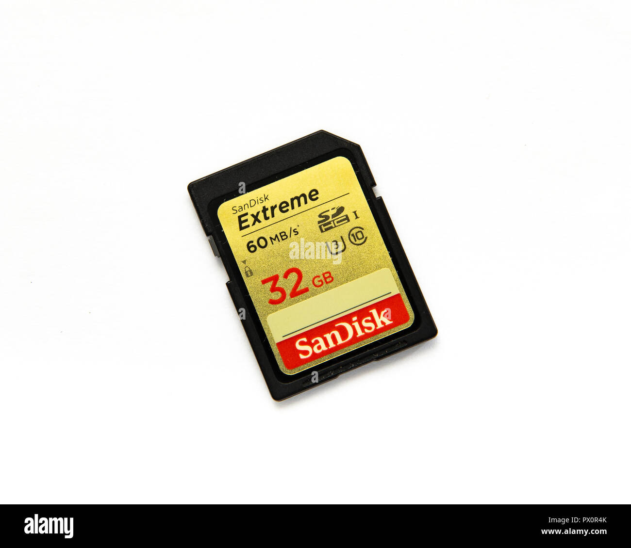 A SanDisk Extreme 32GB SDXC UHS-I Memory Card isolated on white a shock-proof, temperature-proof, waterproof, and x-ray-proof data storage card. Stock Photo