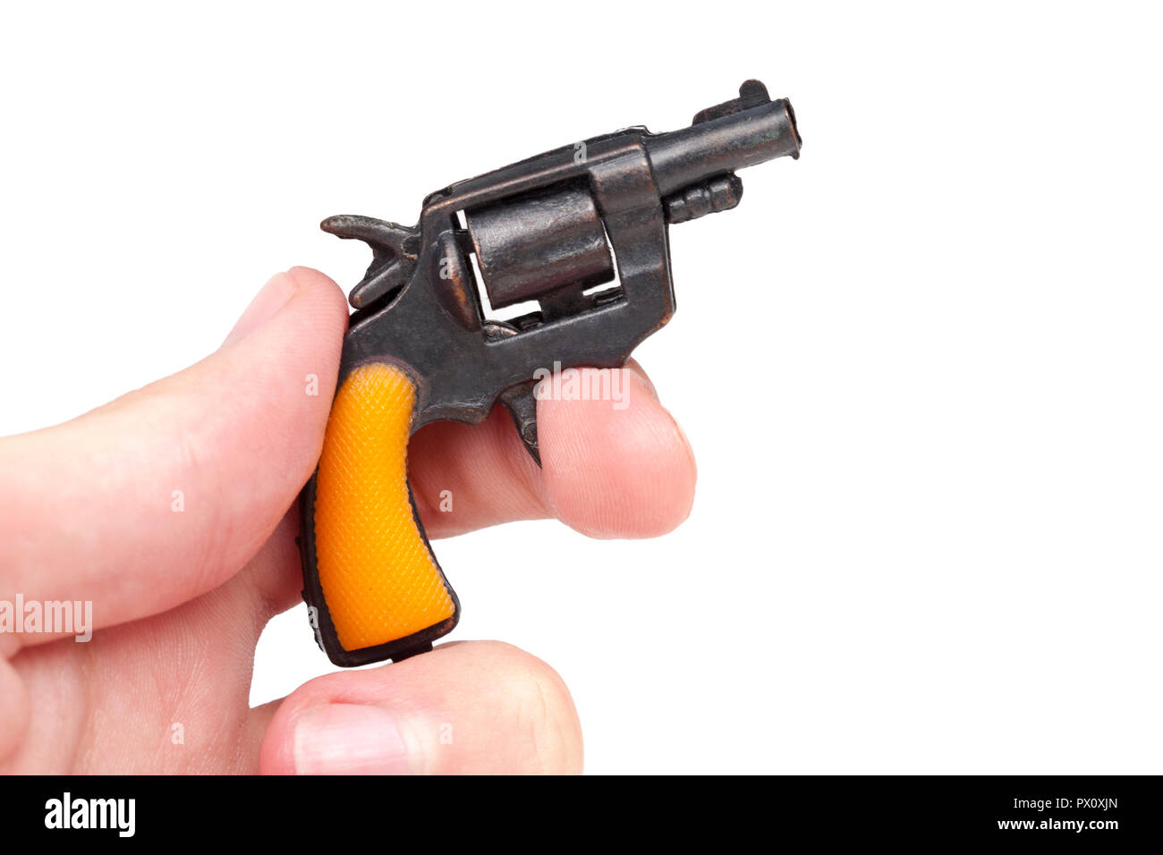 Hand holding small tiny gun prop pulling the trigger isolated on white background Stock Photo