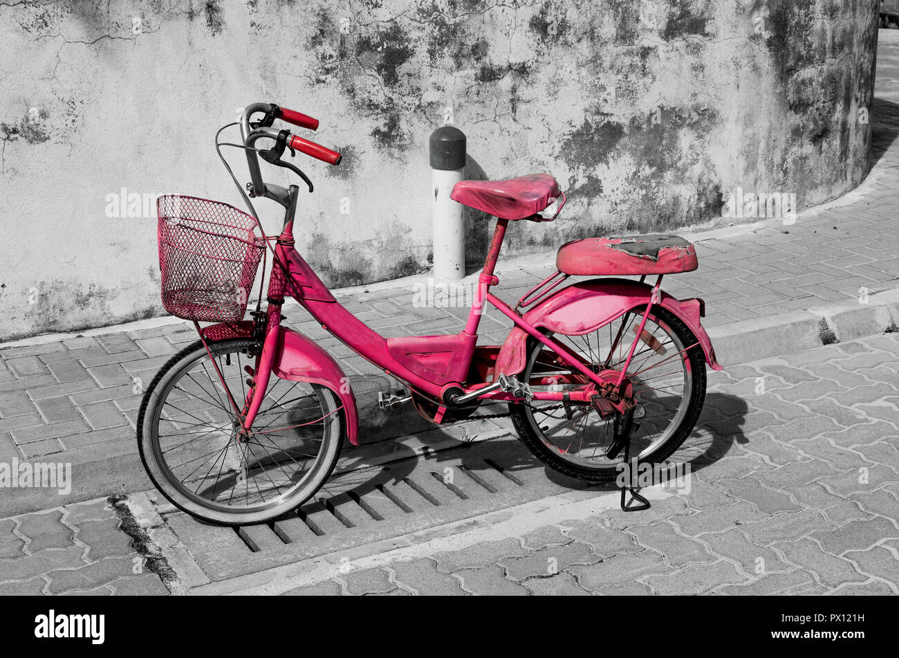Pink bicycle Meedhoo Raa Atoll Island Maldives. Stock Photo