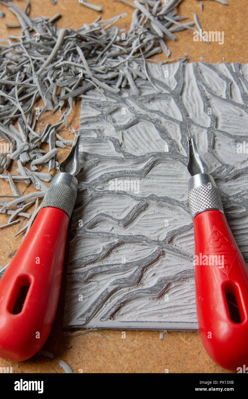 Lino cut with lino cutter and offcuts by it Stock Photo Alamy