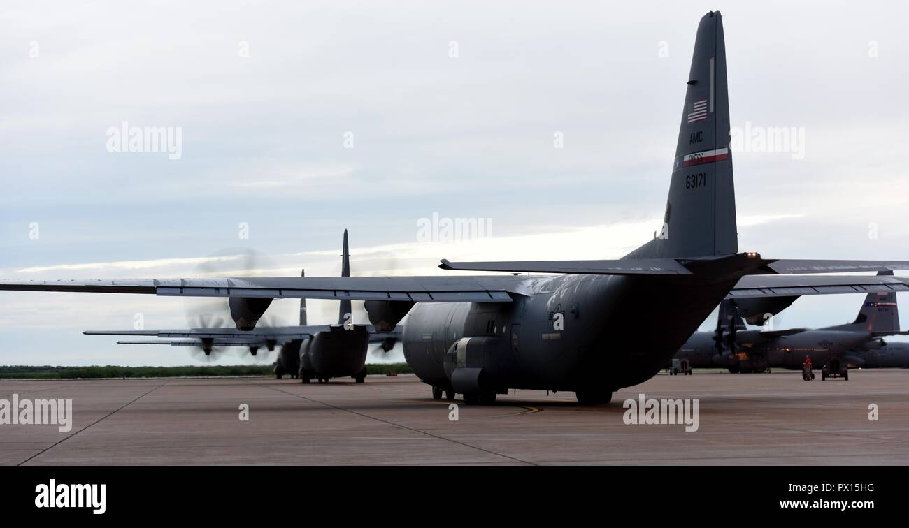 U.S. Air Force C-130J Super Hercules’ prepare to take off from Dyess Air Force Base, Texas, May 4, 2018. The Air Force provides the Space-Available Travel for eligible military personnel, families, retirees and veterans with 100% disability. Those eligible will fall under one of the six categories on the priority list. Although space is available, it is not a guarantee due to changes in flight status, the space becoming unavailable or the possibility of hazardous cargo. (U.S. Air Force photo by Airmen 1st Class Mercedes Porter) Stock Photo