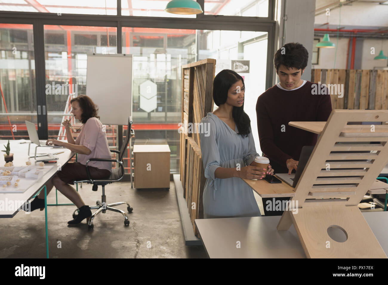 Executives working on laptop Stock Photo