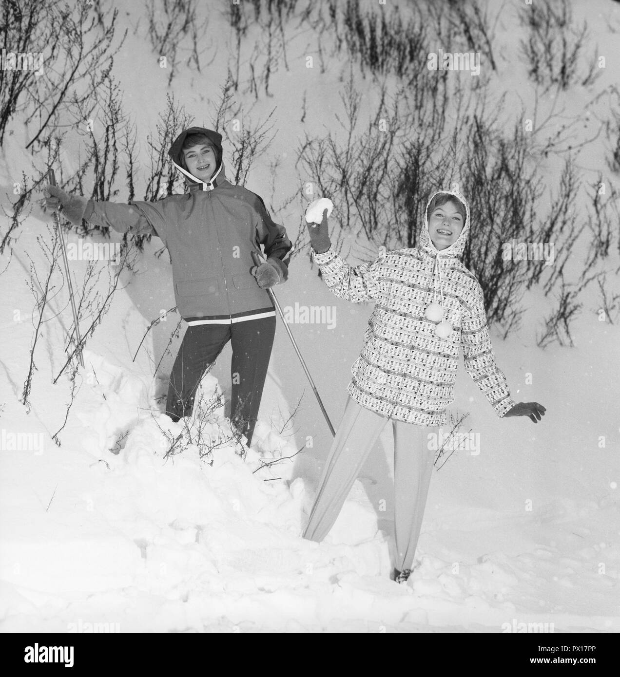 Winter fashion the 1950s. Two young women models this years winter clothes. They are wearing the typical 50s sports jackets and spandex sports trousers.  Sweden January 1959. Stock Photo