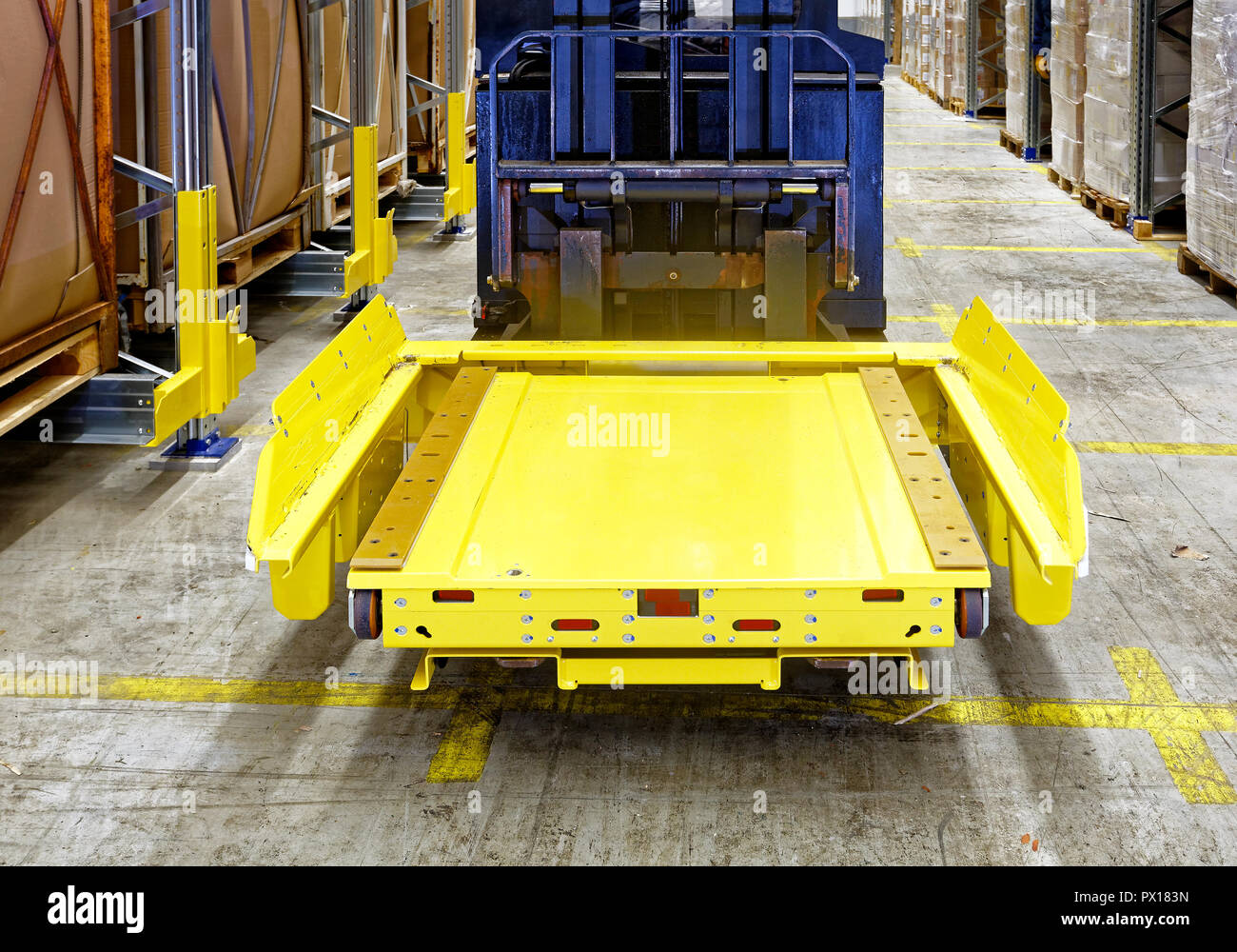 Pallet Shuttle Robot at Forklift in Semi Automated Warehouse Stock Photo