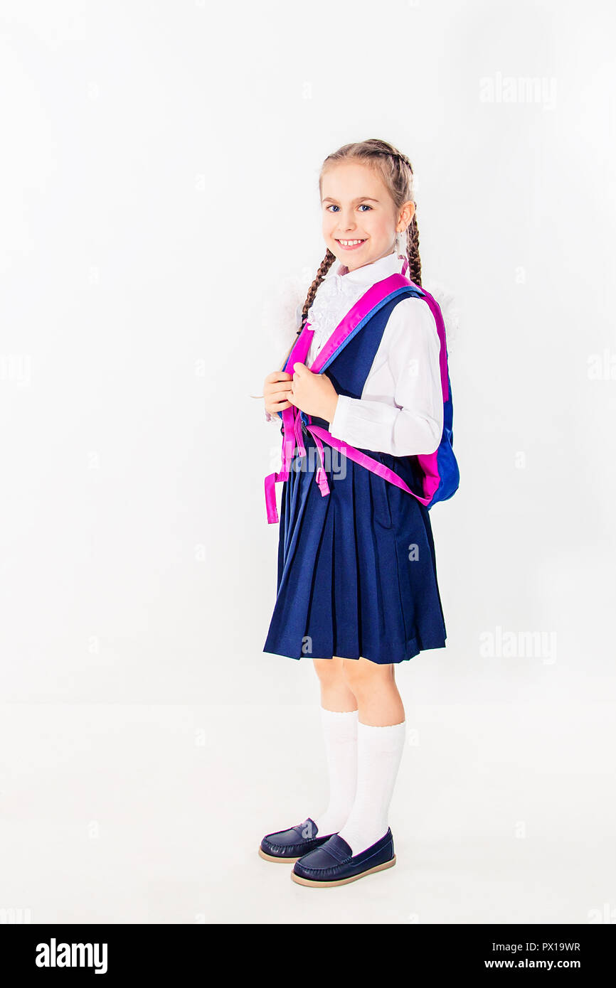 Cute schoolgirl with notebooks and books on a white background ...