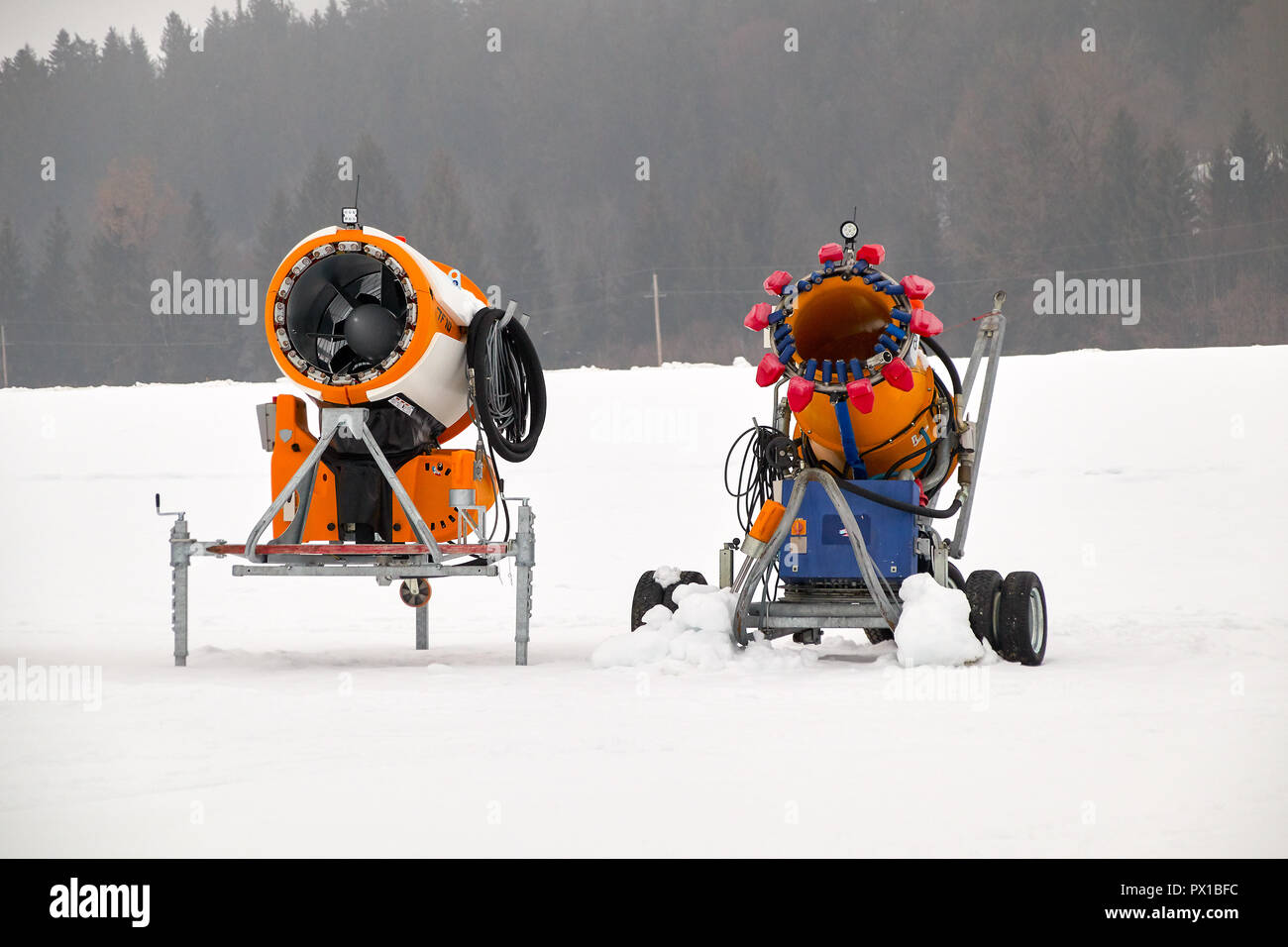 Snow gun machine waiting for frost with sun flare background, snowmaker  machine. Color effect Stock Photo - Alamy