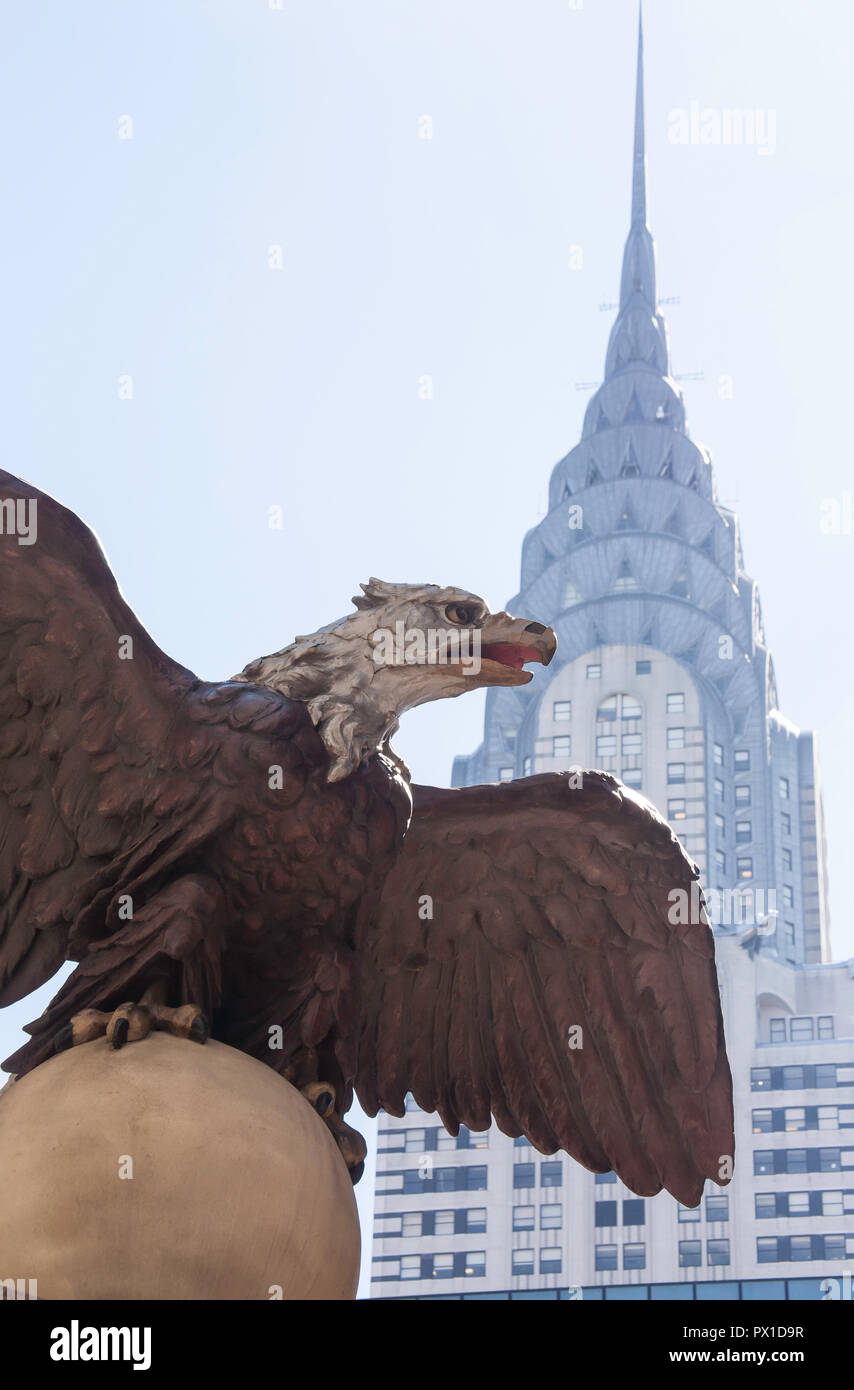 Massive iron eagle at Grand Central Terminal with Chrysler Building in the background, NYC, USA Stock Photo