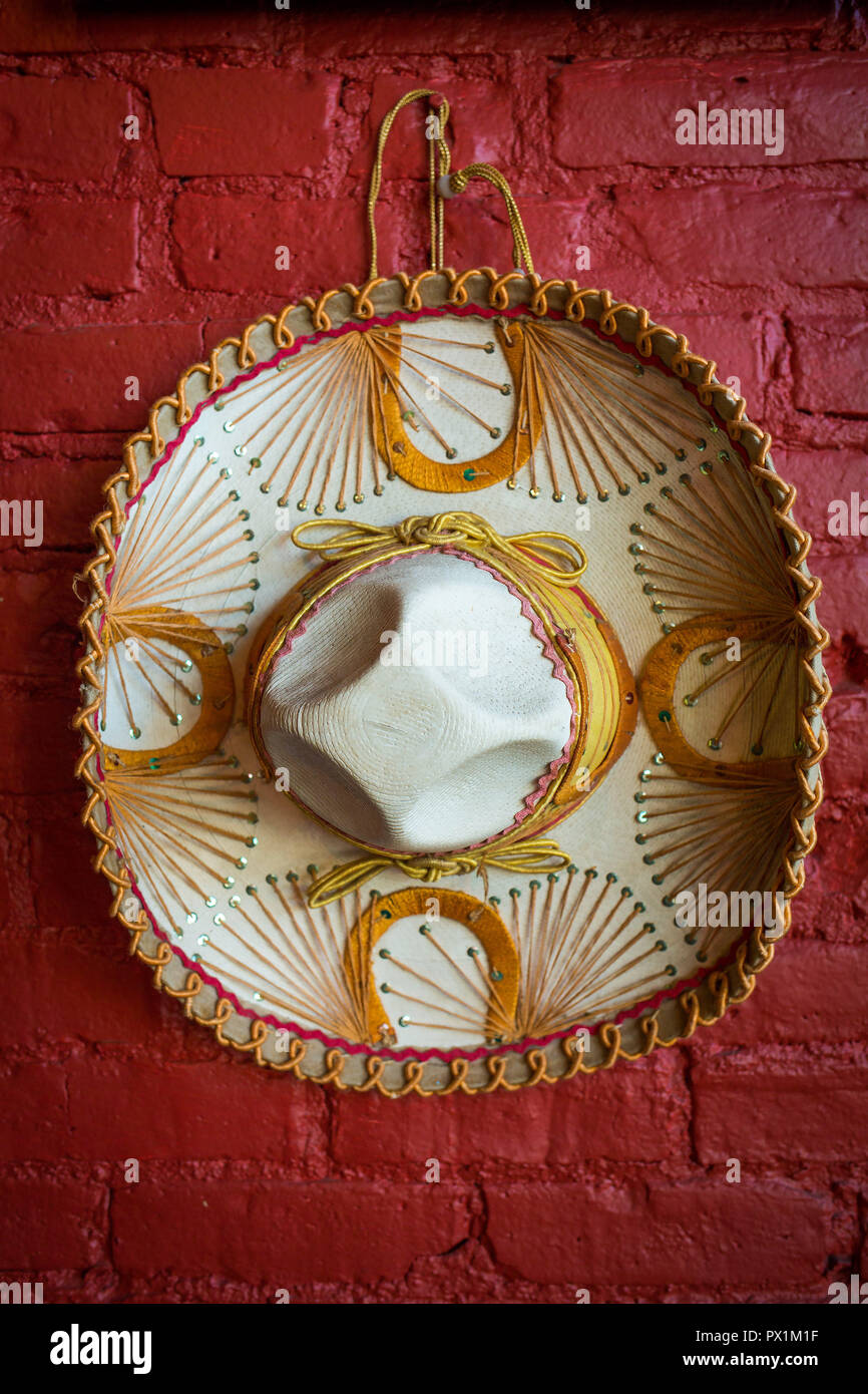 Mexican decorative hat sombrero on the red wall Stock Photo