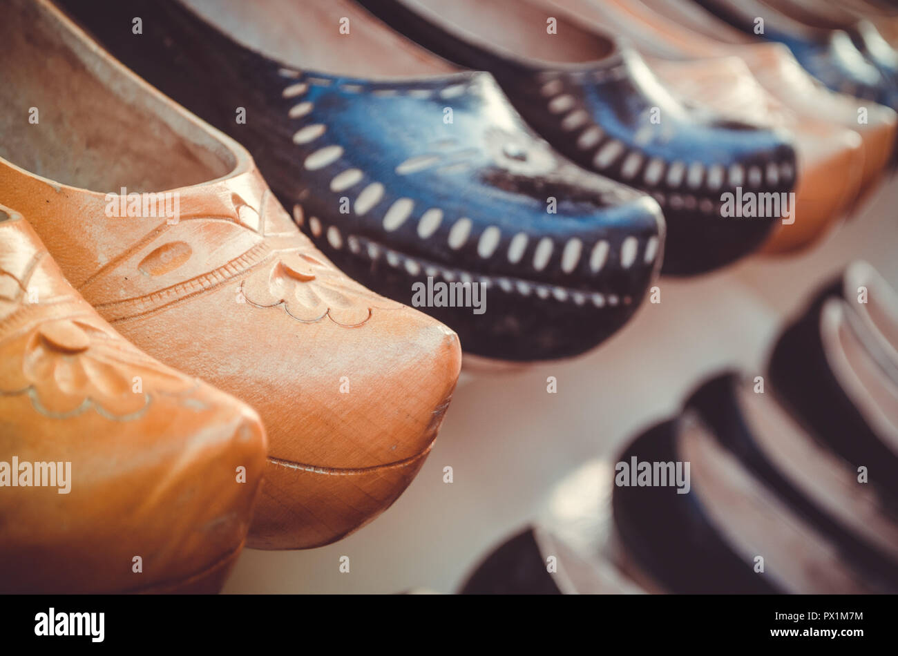 typical spanish handcrafted wooden shoes called zuecos form two lines