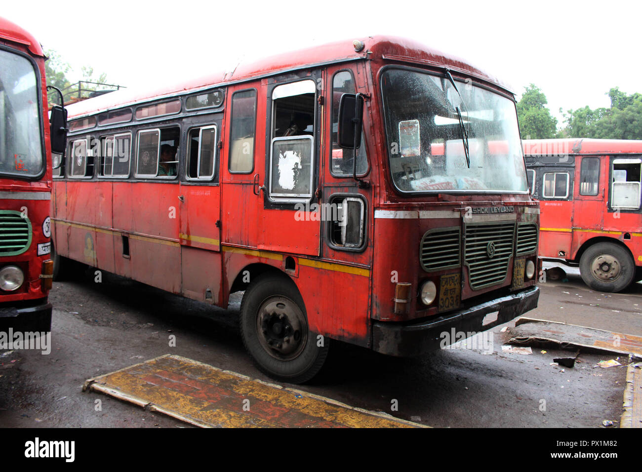 Translation: The red local public bus in Aurangabad, on the way to Ajanta or Ellora Caves. Stock Photo