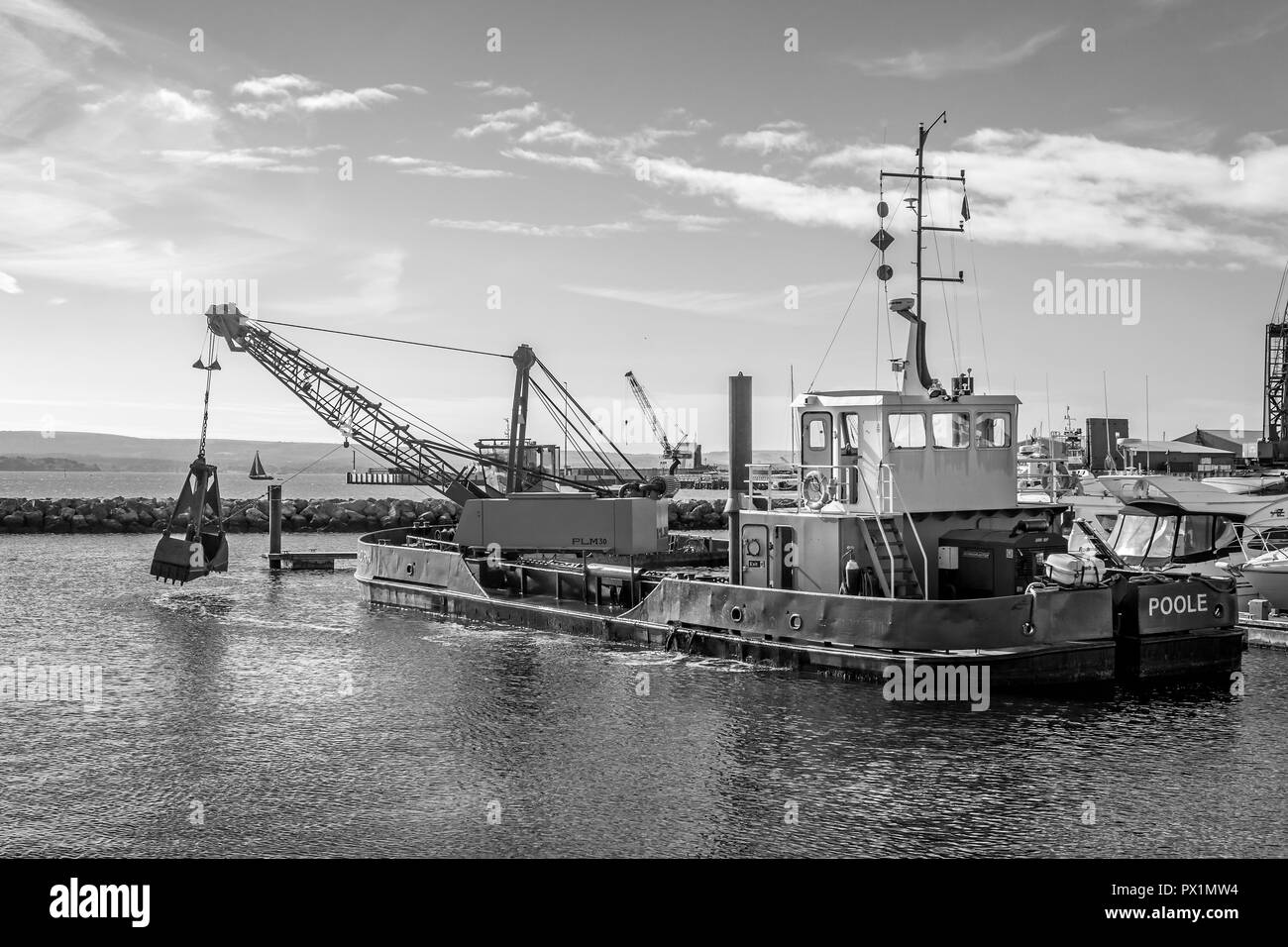Grab Dredger C H Horn at work dredging Poole Harbour marina in Dorset, UK on 18 October 2018 Stock Photo