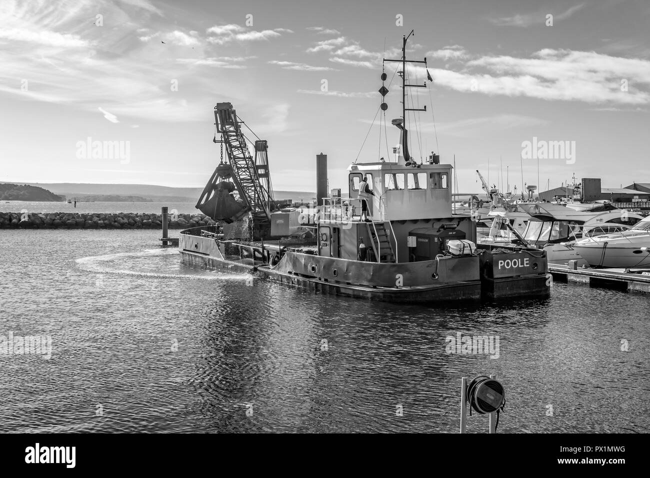Grab Dredger C H Horn at work dredging Poole Harbour marina in Dorset, UK on 18 October 2018 Stock Photo