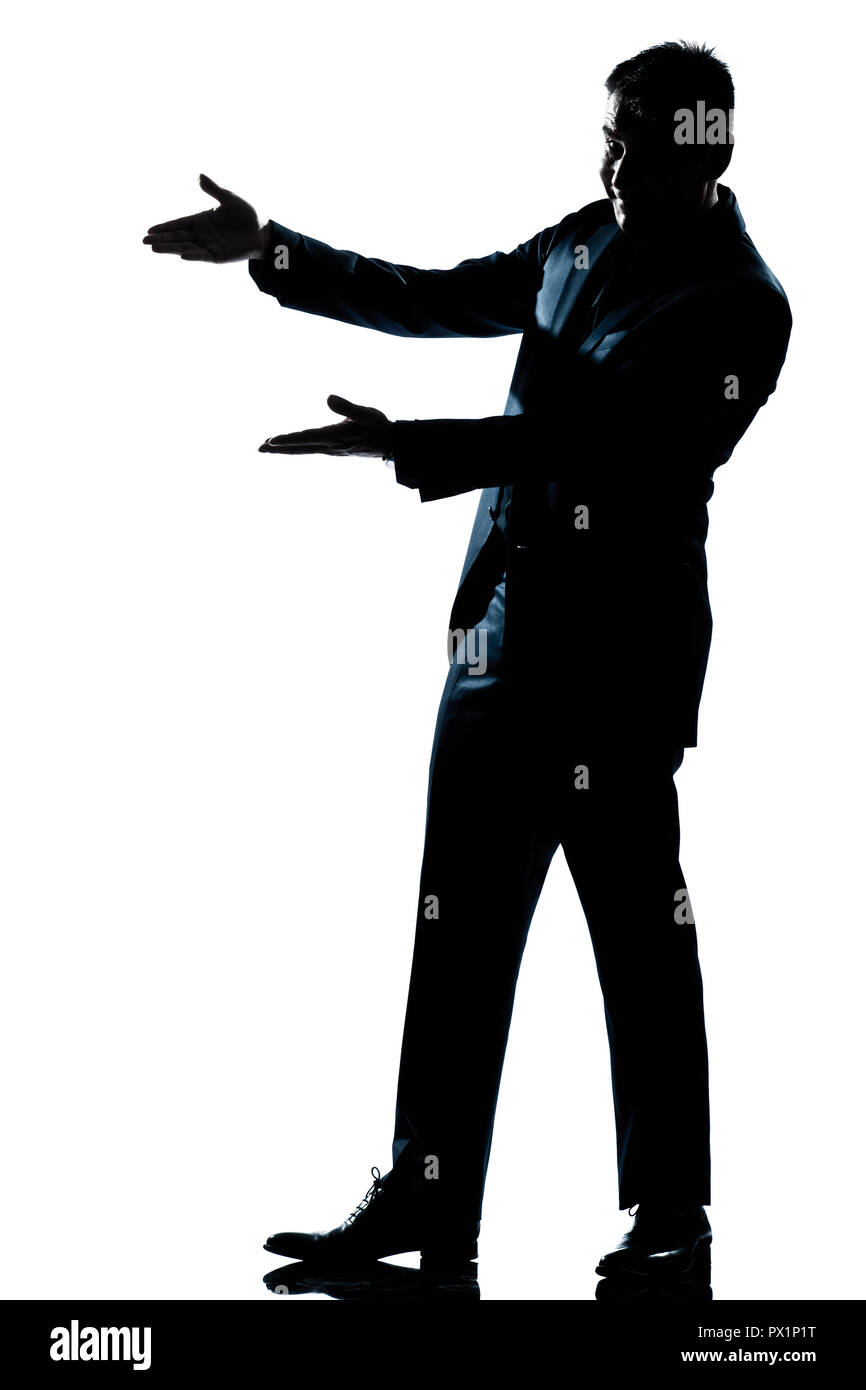 one caucasian man showing pointing empty copy space  full length silhouette in studio isolated white background Stock Photo