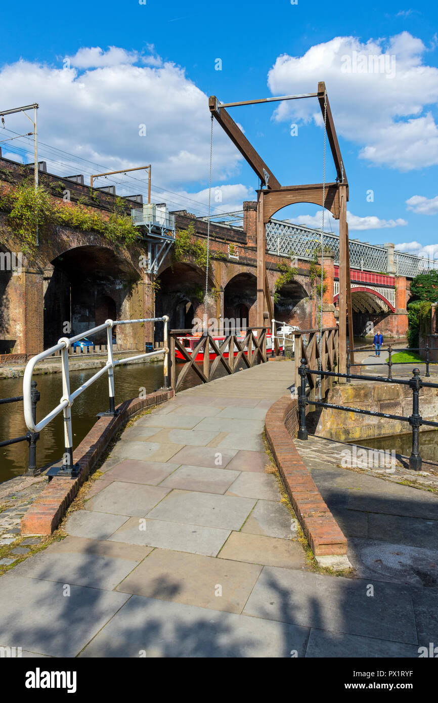 Victorian railway bridge from a footbrige at Slate Wharf on the Bridgewater Canal at Castlefield, Manchester, England, UK Stock Photo