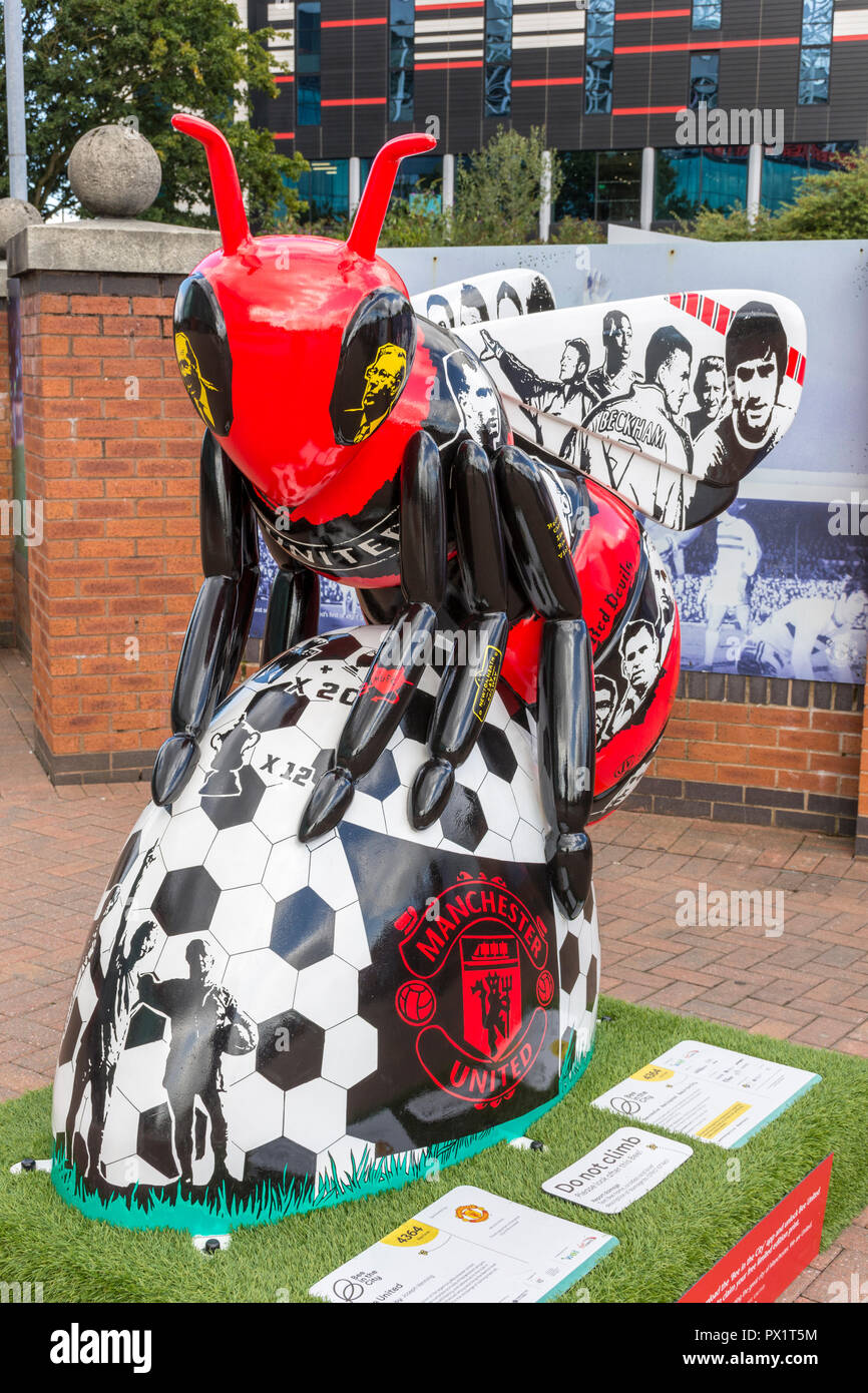 Bee United, by Joseph Venning.  One of the Bee in the City sculptures, at the Manchester United stadium, Old Trafford, Manchester, UK. Stock Photo