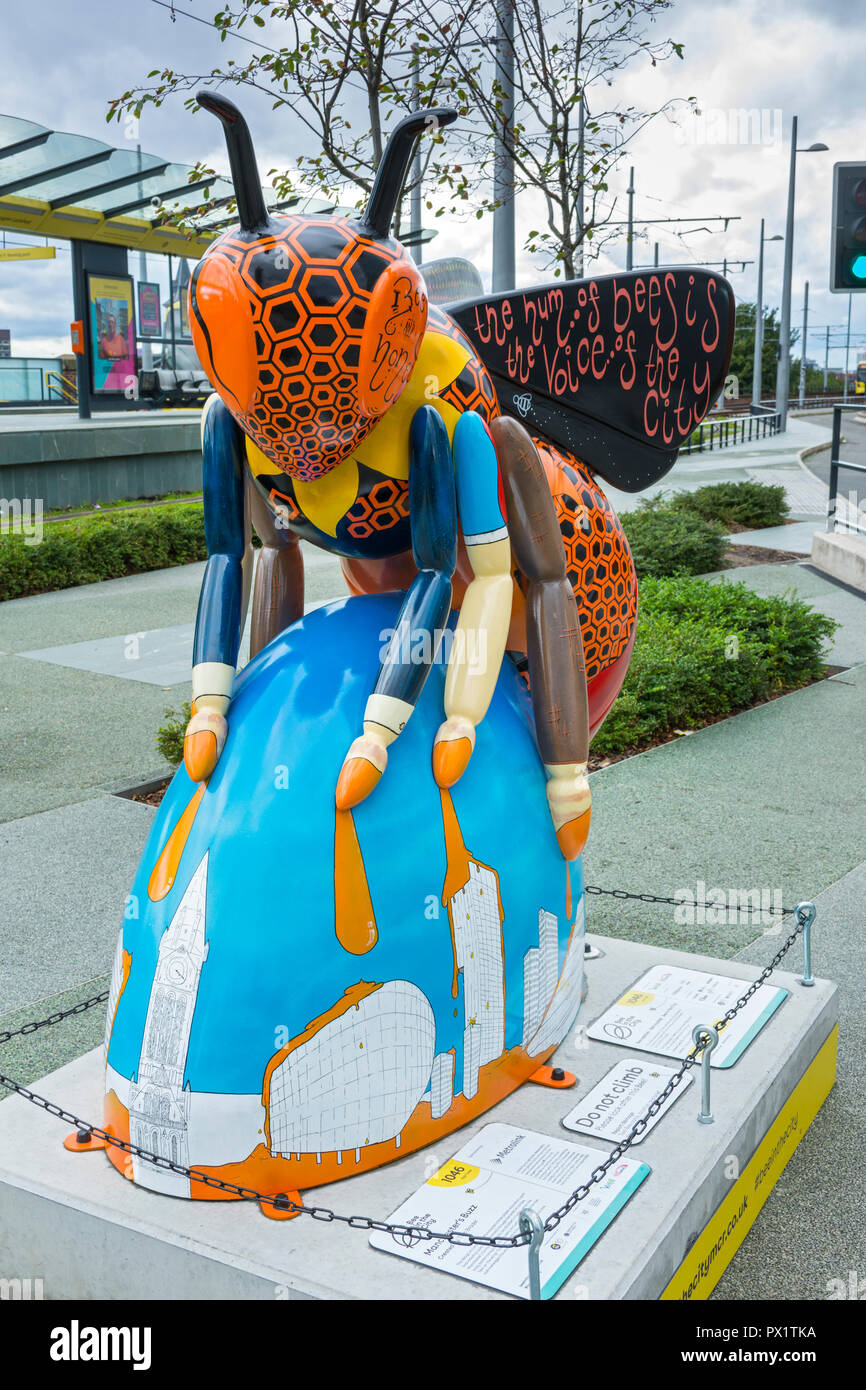 Manchester's Buzz, by Tom Brader.  One of the Bee in the City sculptures, at the Deansgate-Castlefield Metrolink tram stop, Manchester, UK. Stock Photo