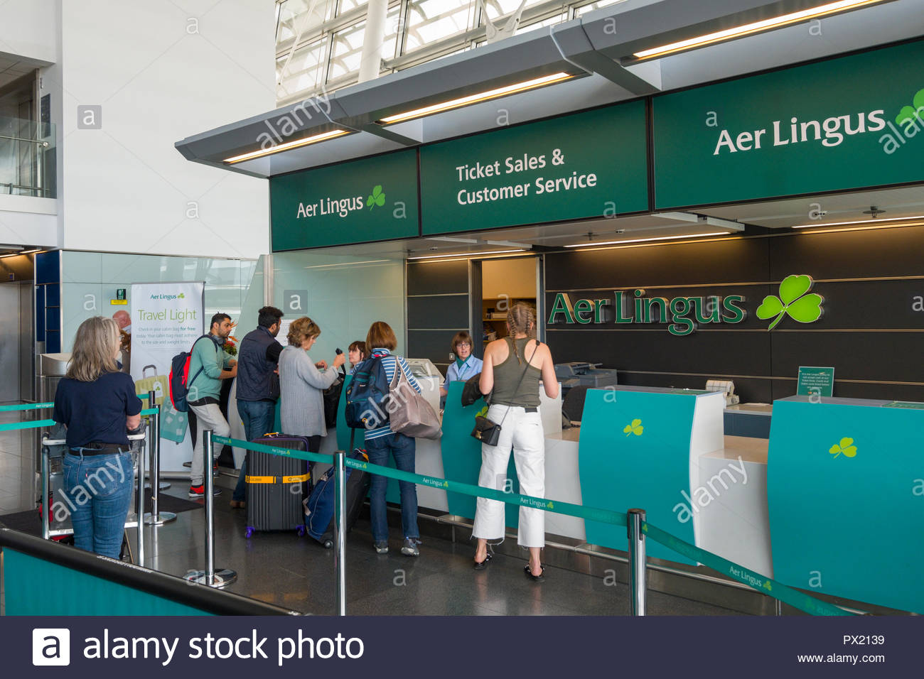 People Standing At The Aer Lingus Ticket Sales And Customer