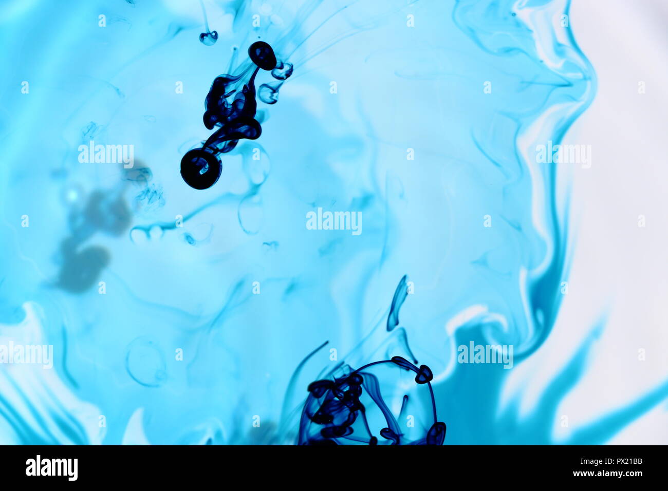 Naturally Flowing Blue Food Dye in Water Stock Photo