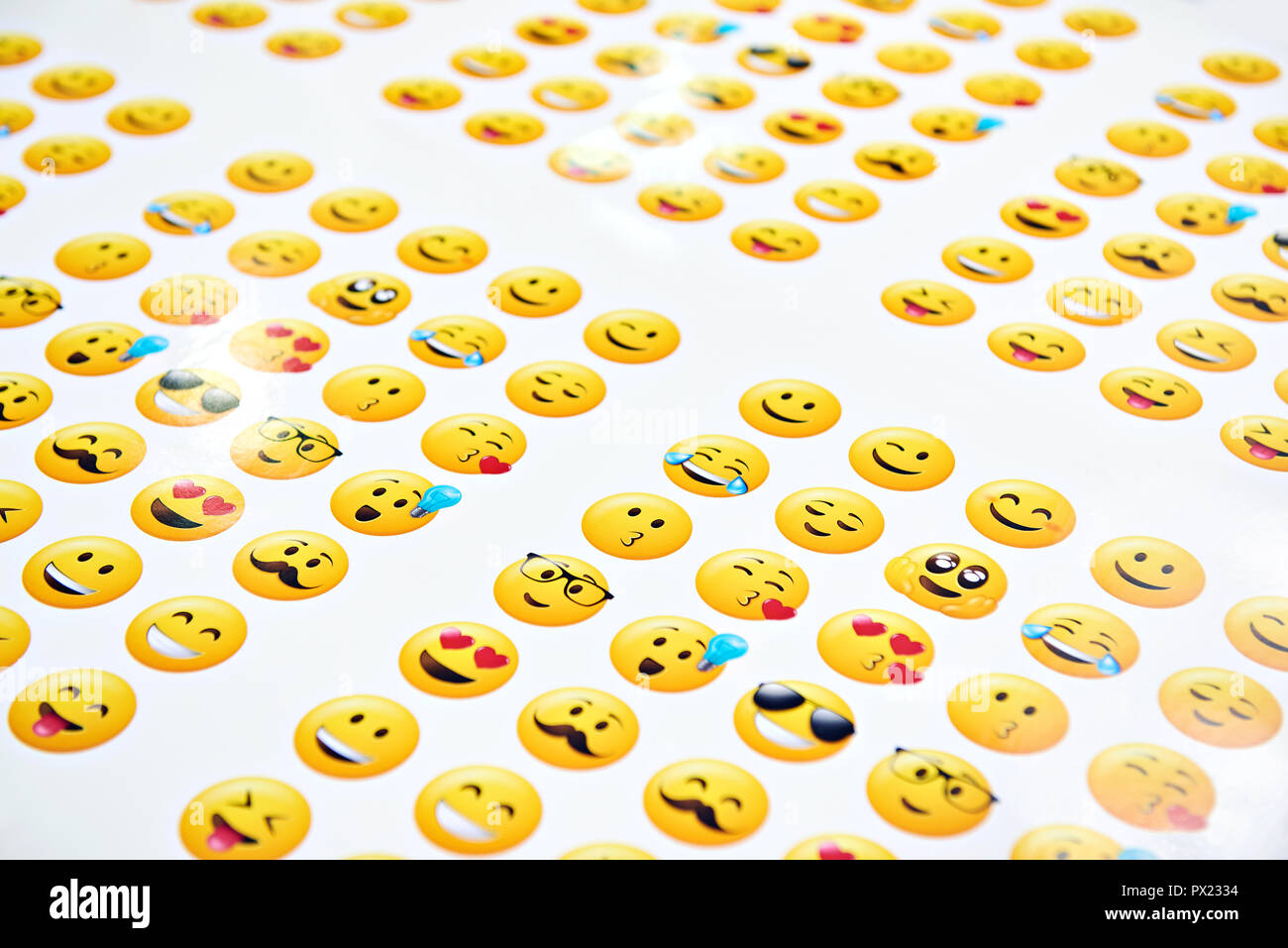 Funny yellow smileys on a white background Stock Photo