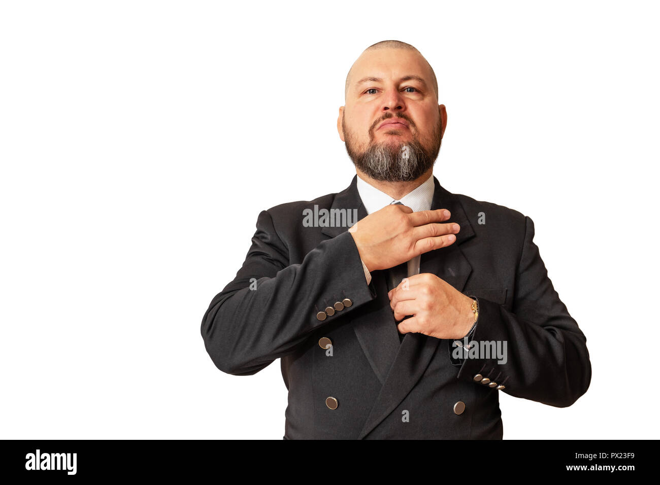 Respectable man demonstrates his superiority and straightens his tie around his neck. Stock Photo