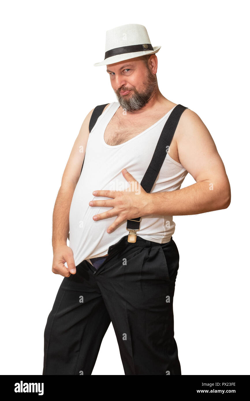 A man embraces his big belly with one hand, and the other pulls on his jersey showing his size. A man's big belly, as if to say it's time to lose weig Stock Photo