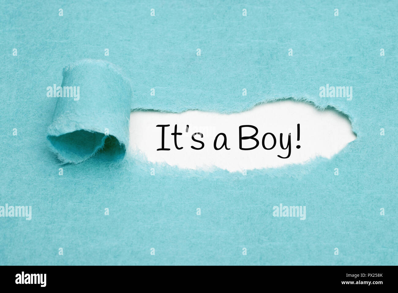 Announcement It Is A Boy Appearing Behind Ripped Blue Paper Stock Photo Alamy