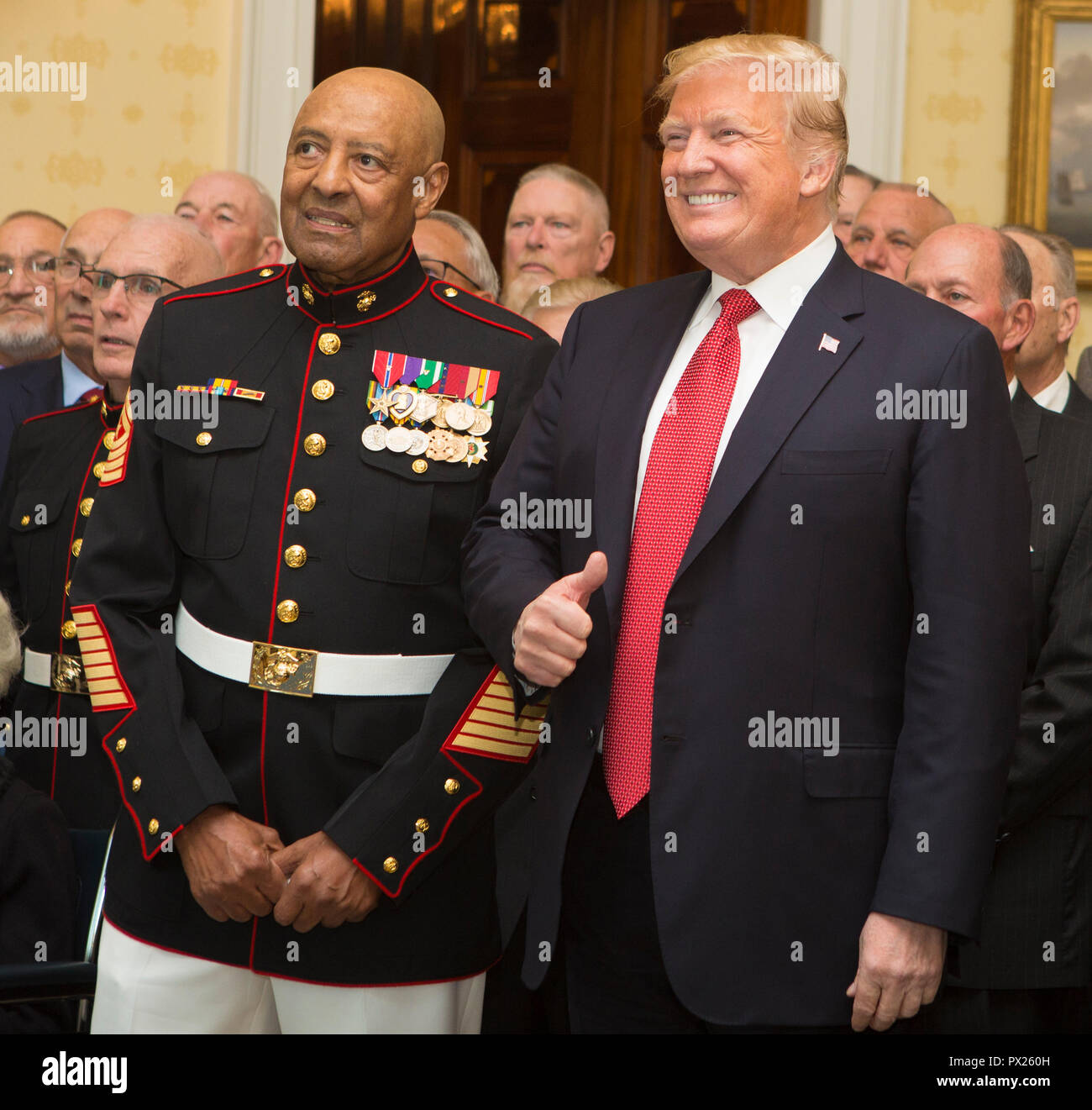 President of the United States Donald J. Trump poses for a photo with retired U.S. Marine Corps Sgt. Maj. John L. Canley, the 300th Marine Medal of Honor recipient, at the White House in Washington, D.C., Oct. 17, 2018. From Jan. 31, to Feb. 6 1968 in the Republic of Vietnam, Canley, the company gunnery sergeant assigned to Alpha Company, 1st Battalion, 1st Marines, took command of the company, led multiple attacks against enemy-fortified positions, rushed across fire-swept terrain despite his own wounds and carried wounded Marines into Hue City, including his commanding officer, to relieve fr Stock Photo