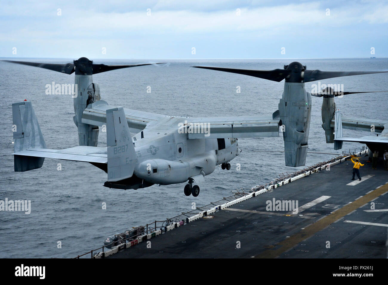EAST CHINA SEA (Oct. 16, 2018) A Sailor directs an MV-22 Osprey ...