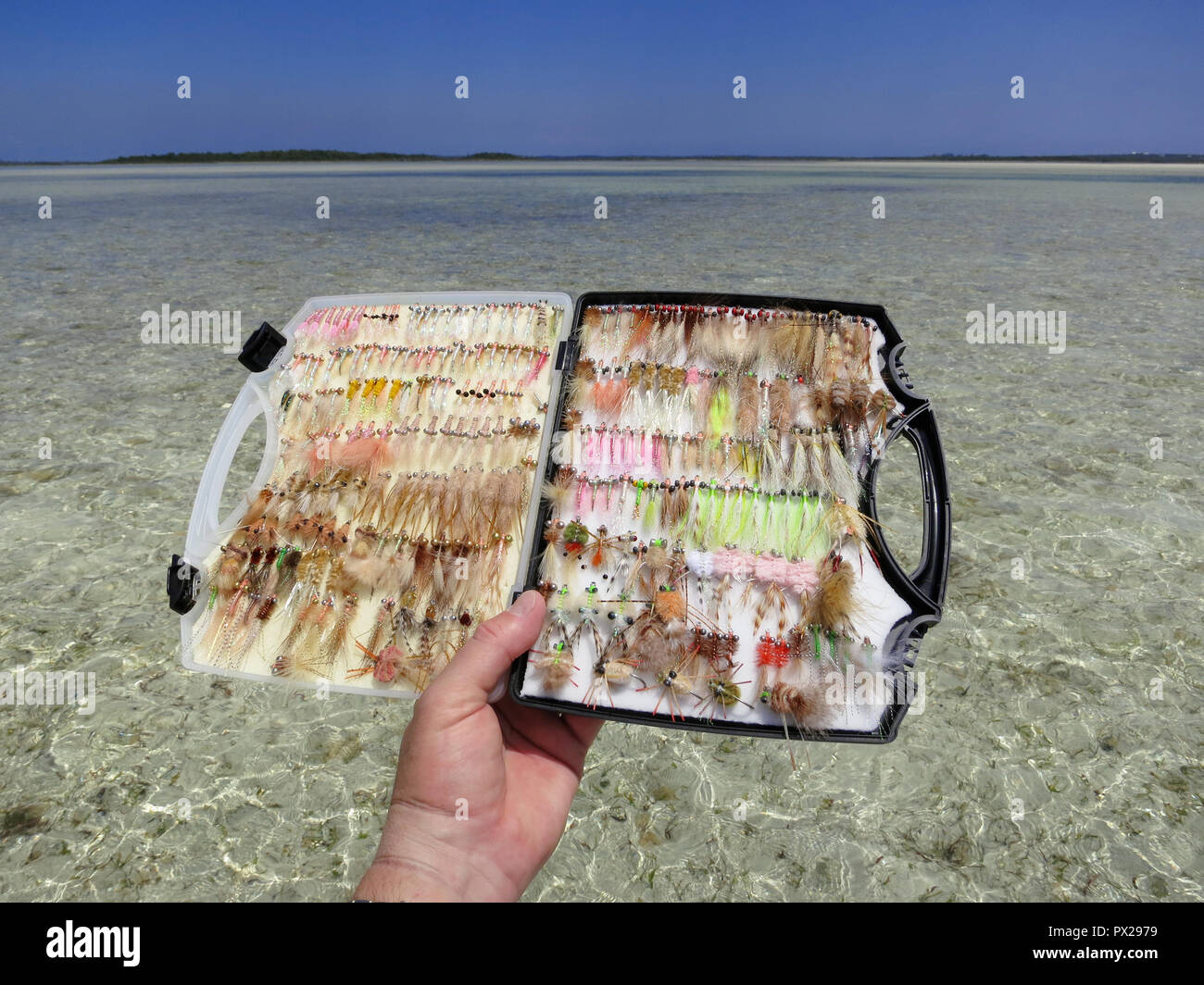 Fly box filled with flies for fly fishing in shallow water for bonefish and permit. Stock Photo