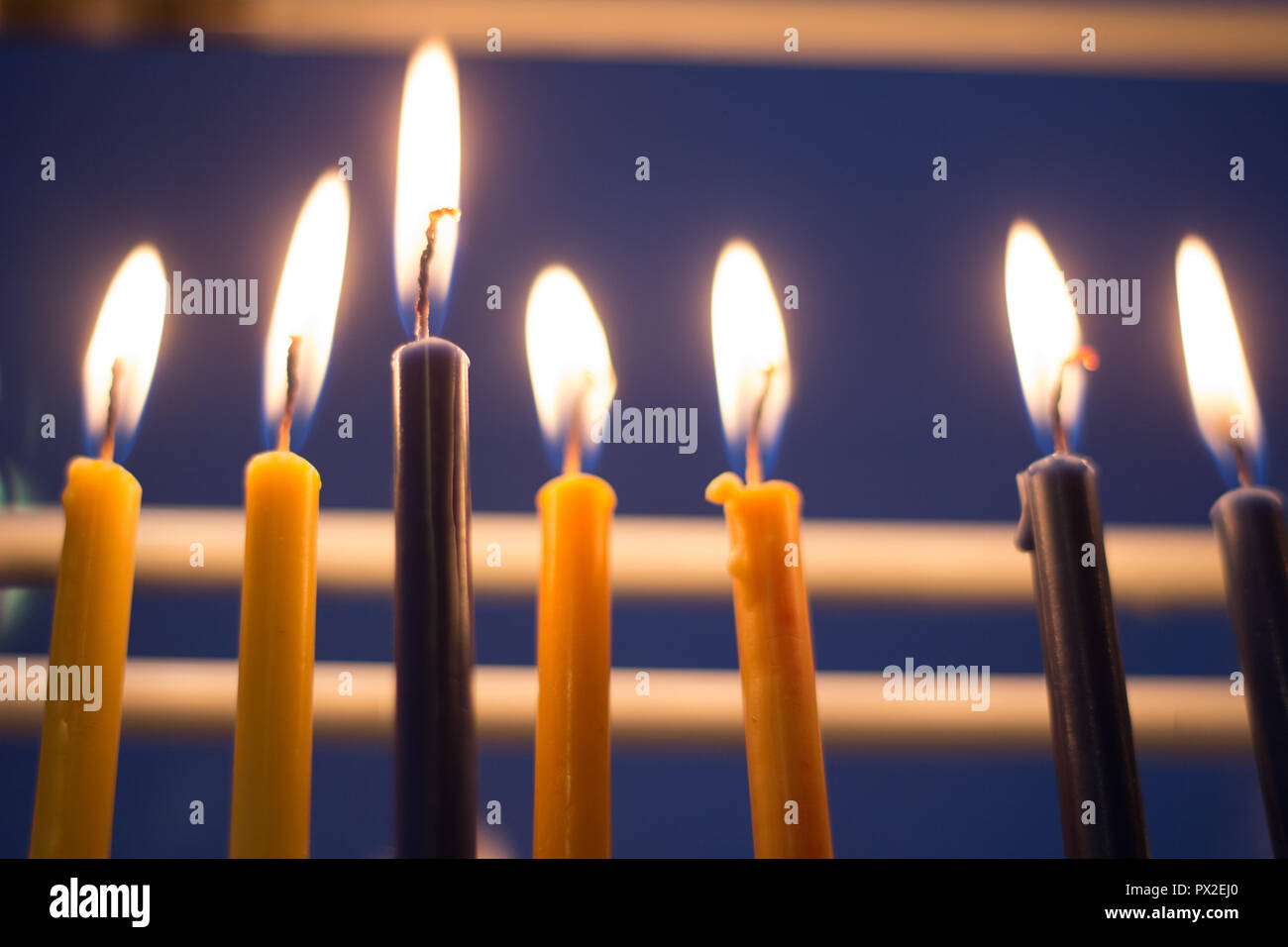 Candle Menora lit in window on Hanuka Holiday Stock Photo Alamy
