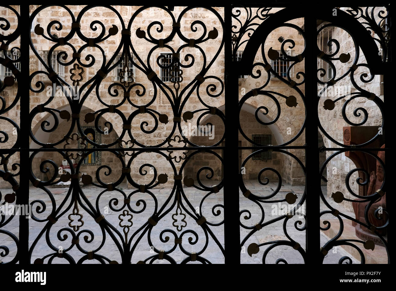 Stylized Interlaced Floral Motifs Decorate The Wrought Iron