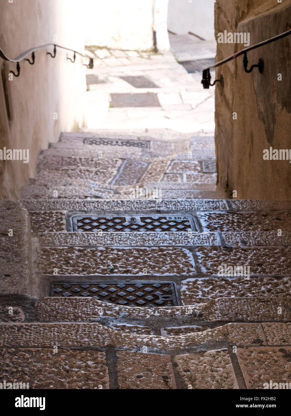 Street scene with steps in Monte Sant'Angelo, on the Gargano Promontory in Puglia, southern Italy. Stock Photo