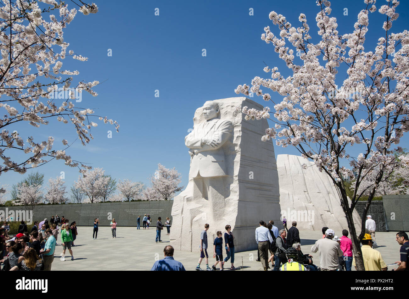 WASHINGTON, DC - APRIL 10, 2014: Tourists crowds gather around the Martin Luther King Jr. Memorial during Cherry Blossom Festival to pay respects and  Stock Photo