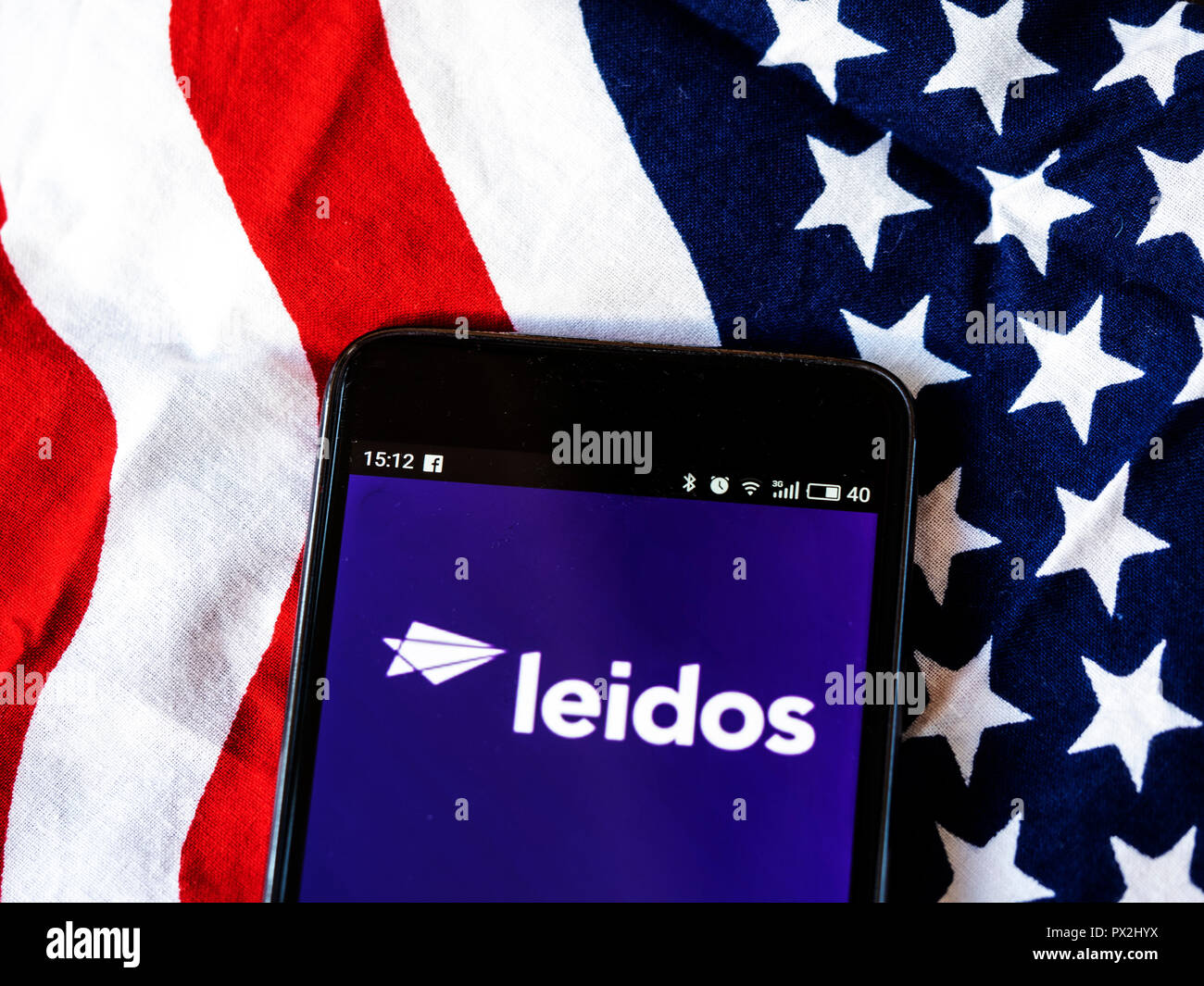 Leidos Scientific research company logo seen displayed on smart phone. Leidos, formerly known as Science Applications International Corporation, is an American defense, aviation, information technology, and biomedical research company,  that provides scientific, engineering, systems integration, and technical services. Stock Photo