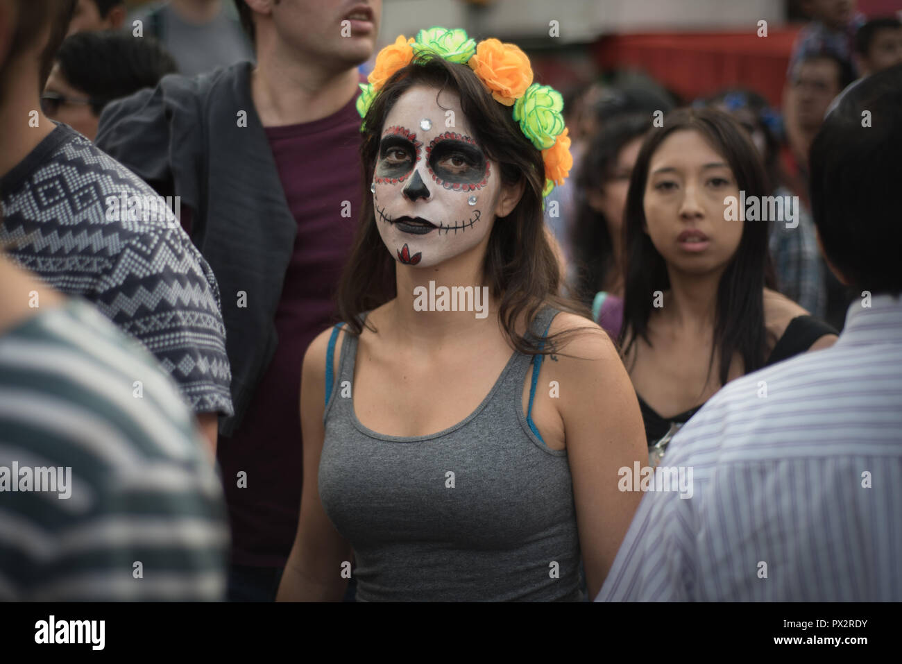 A young woman wearing typical 'catrina' makeup at Mexico City's Day of the Dead parade Stock Photo